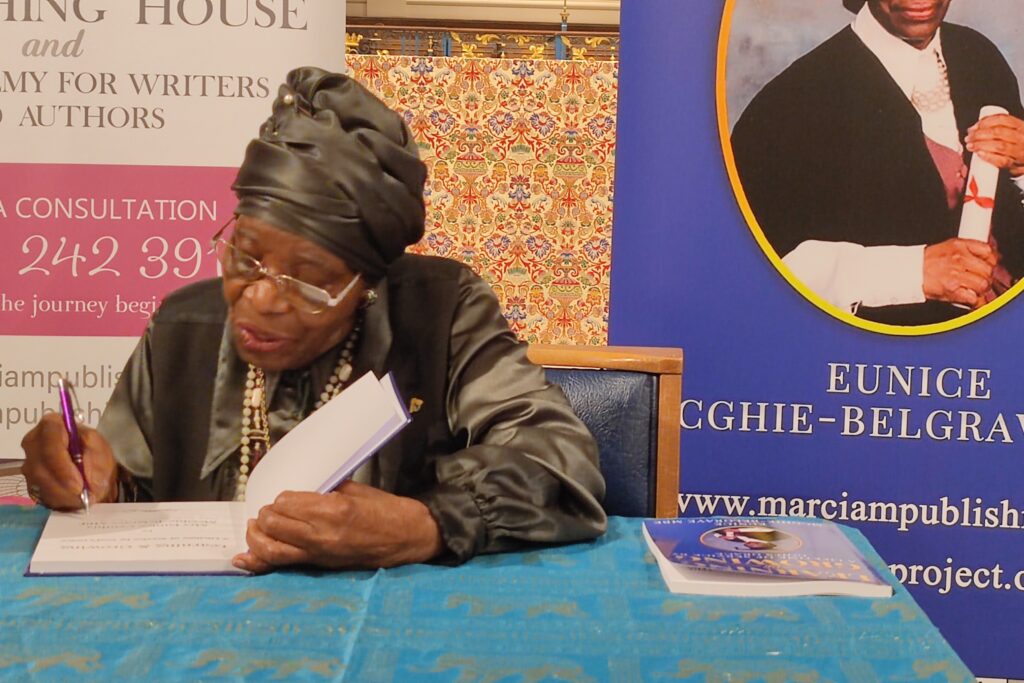 Eunice autographing her autobiography