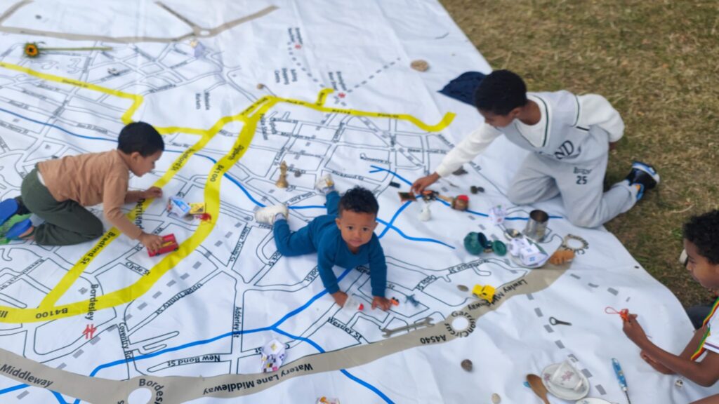Children play on a map