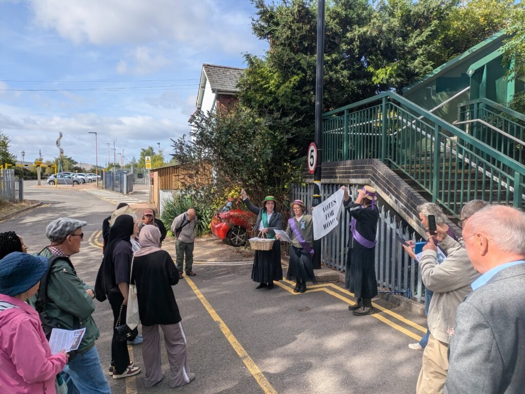 Suffragettes lead the singing at Kings Norton
